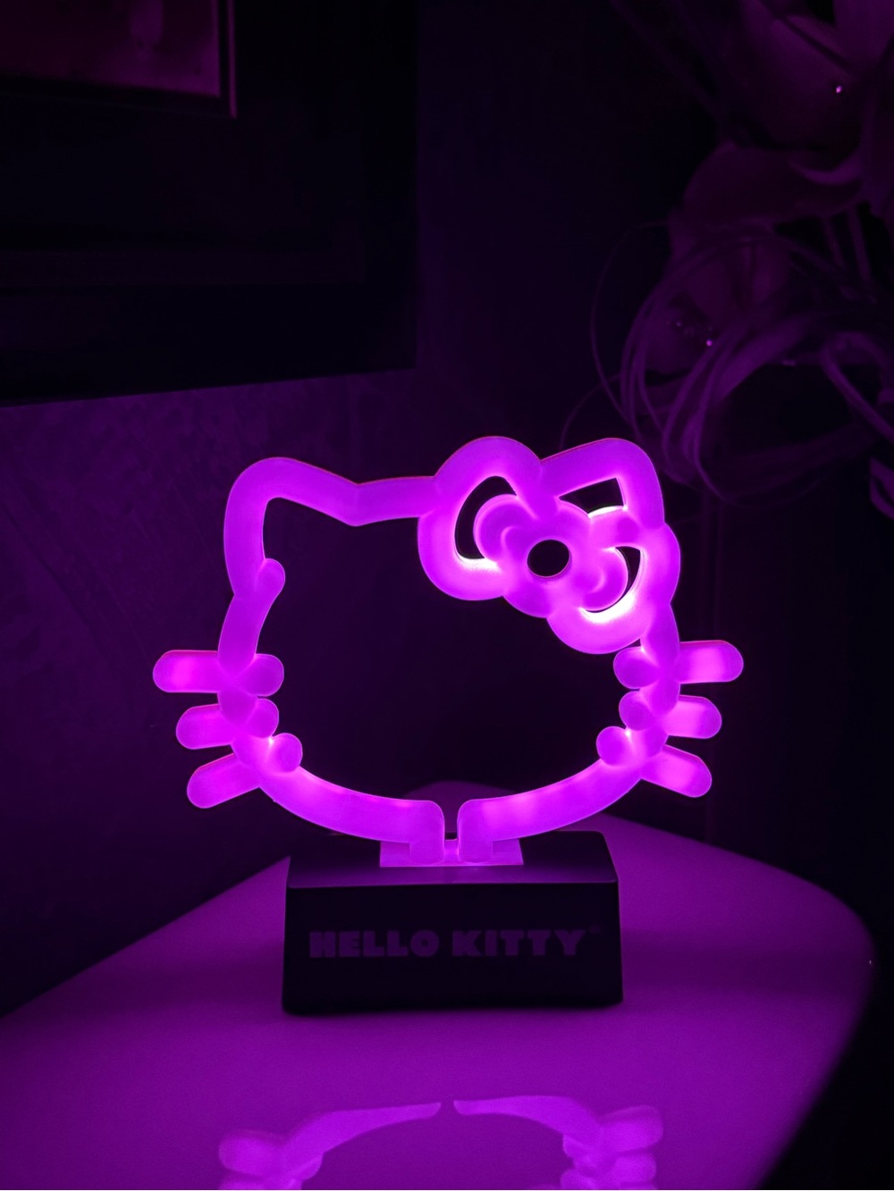 Hello Kitty LED Neon Night light glowing in purple